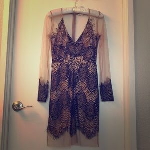Sheer long sleeved lace dress